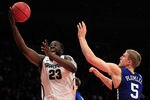 NEW YORK - NOVEMBER 15: Draymond Green #23 of the Michigan State Spartens drives to the basket against Mason Plumlee #5 of the Duke Blue Devils 5quare Garden on November 15, 2011 in New York City.  (Photo by Chris Trotman/Getty Images)