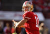 SAN FRANCISCO, CA - JANUARY 14:  Alex Smith #11 of the San Francisco 49ers looks to pass from the pocket during the NFC Divisional playoff game against the New Orleans Saints at Candlestick Park on January 14, 2012 in San Francisco, California.  (Photo by Ezra Shaw/Getty Images)