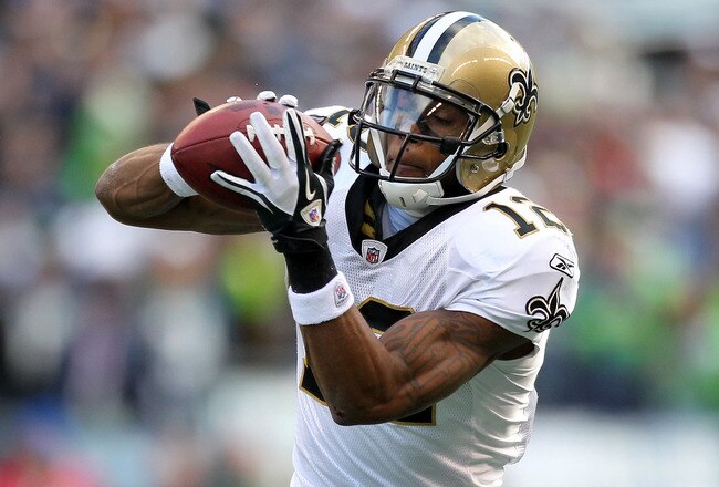 SEATTLE, WA - JANUARY 08:  Marques Colston #12 of the New Orleans Saints catches a pass against the Seattle Seahawks during the 2011 NFC wild-card playoff game at Qwest Field on January 8, 2011 in Seattle, Washington.  (Photo by Otto Greule Jr/Getty Images)