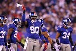 EAST RUTHERFORD, NJ - JANUARY 01:  Jason Pierre-Paul #90 of the New York Giants reacts while playing against the Dallas Cowboys at MetLife Stadium on January 1, 2012 in East Rutherford, New Jersey.  (Photo by Al Bello/Getty Images)