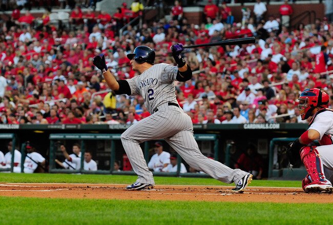 ST. LOUIS, MO - AUGUST 14: Troy Tulowitzki #2 of the Colorado Rockies follows through on a one-run single against the St. Louis Cardinals at Busch Stadium on August 14, 2011 in St. Louis, Missouri.  (Photo by Jeff Curry/Getty Images)