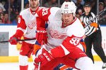 UNIONDALE, NY - JANUARY 10: Johan Franzen #93 of the Detroit Red Wings in action against the New York Islanders during their game on January10, 2012 at the Nassau Coliseum in Uniondale, New York.  (Photo by Al Bello/Getty Images)
