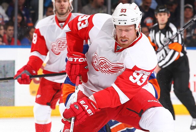 UNIONDALE, NY - JANUARY 10: Johan Franzen #93 of the Detroit Red Wings in action against the New York Islanders during their game on January10, 2012 at the Nassau Coliseum in Uniondale, New York.  (Photo by Al Bello/Getty Images)