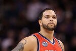 PHOENIX, AZ - JANUARY 13:  Deron Williams #8 of the New Jersey Nets in action during the NBA game against the Phoenix Suns at US Airways Center on January 13, 2012 in Phoenix, Arizona. The Nets defeated the Suns 110-103.   NOTE TO USER: User expressly acknowledges and agrees that, by downloading and or using this photograph, User is consenting to the terms and conditions of the Getty Images License Agreement.  (Photo by Christian Petersen/Getty Images)