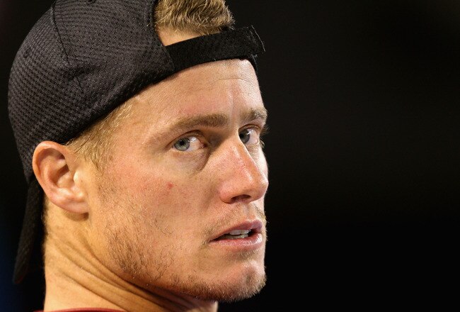 MELBOURNE, AUSTRALIA - JANUARY 19:  Lleyton Hewitt of Australia looks on between games in his second round match against Andy Roddick of the United States during day four of the 2012 Australian Open at Melbourne Park on January 19, 2012 in Melbourne, Australia.  (Photo by Matt Blyth/Getty Images)