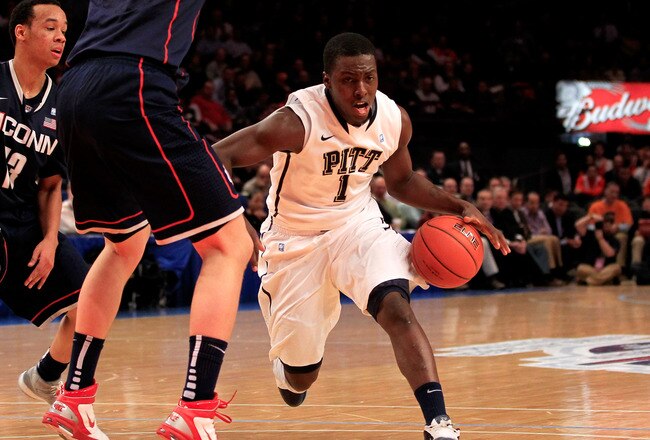 NEW YORK, NY - MARCH 10: Travon Woodall #1 of the Pittsburgh Panthers drives with the ball against Tyler Olander #10 of the Connecticut Huskies during the quarterfinals of the 2011 Big East Men's Basketball Tournament presented by American Eagle Outfitters  at Madison Square Garden on March 10, 2011 in New York City.  (Photo by Chris Trotman/Getty Images)