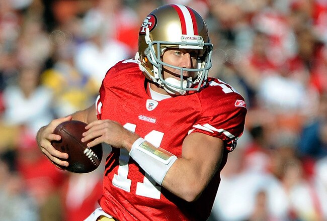 SAN FRANCISCO, CA - DECEMBER 04:  Alex Smith #11 of the San Francisco 49ers runs with the ball for a first down against the St Louis Rams at Candlestick Park on December 4, 2011 in San Francisco, California.  (Photo by Thearon W. Henderson/Getty Images)