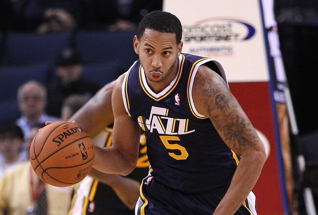 OAKLAND, CA - JANUARY 07:  Devin Harris #5 of the Utah Jazz in action against the Golden State Warriors at Oracle Arena on January 7, 2012 in Oakland, California.  NOTE TO USER: User expressly acknowledges and agrees that, by downloading and or using this photograph, User is consenting to the terms and conditions of the Getty Images License Agreement.  (Photo by Ezra Shaw/Getty Images)