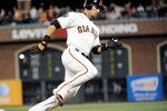SAN FRANCISCO, CA - SEPTEMBER 26: Andres Torres #56 of the San Francisco Giants rounds third base to score on a triple hit by Mike Fontenot #14 against the Colorado Rockies in the third inning during an MLB baseball game at AT&T Park on September 26, 2011 in San Francisco, California.  (Photo by Thearon W. Henderson/Getty Images)
