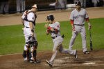 BALTIMORE, MD - SEPTEMBER 28:  Catcher Matt Wieters #32 of the Baltimore Orioles and Mike Aviles #3 of the Boston Red Sox look on as Marco Scutaro #10 (C) celebrates after scocring on a balk during the fourth inning at Oriole Park at Camden Yards on September 28, 2011 in Baltimore, Maryland.  (Photo by Rob Carr/Getty Images)