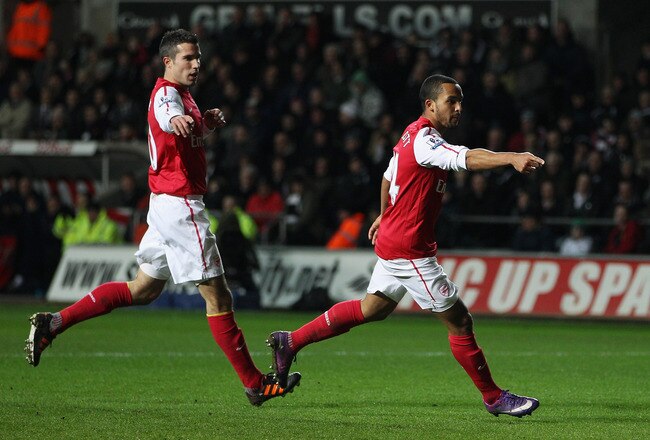 SWANSEA, WALES - JANUARY 15: Theo Walcott of Arsenal (R) celebrates his goal with Robin van Persie during the Barclays Premier League match between Swansea City and Arsenal at Liberty Stadium on January 15, 2012 in Swansea, Wales.  (Photo by Michael Steele/Getty Images)