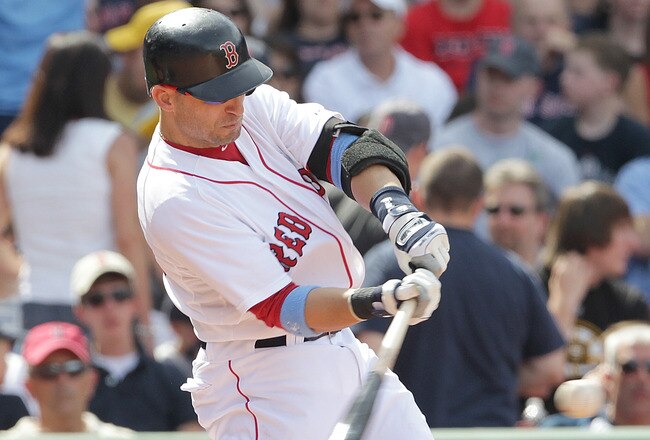 BOSTON, MA  - JUNE 19:  Marco Scutaro #10 of the Boston Red Sox hits a home run against of the Milwaukee Brewers at Fenway Park on June 19, 2011 in Boston, Massachusetts.  (Photo by Jim Rogash/Getty Images)