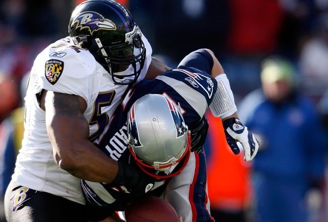 FOXBORO, MA - JANUARY 10:  Tom Brady #12 of the New England Patriots is sacked by Ray Lewis #52 of the Baltimore Ravens during the 2010 AFC wild-card playoff game at Gillette Stadium on January 10, 2010 in Foxboro, Massachusetts. The Ravens won 33-14. (Photo by Elsa/Getty Images)