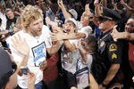 DALLAS, TX - JUNE 16: Forward Dirk Nowitzki of the Dallas Mavericks high fives fans during the Dallas Mavericks Victory celebration on June 16, 2011 in Dallas, Texas. (Photo by Brandon Wade/Getty Images)
