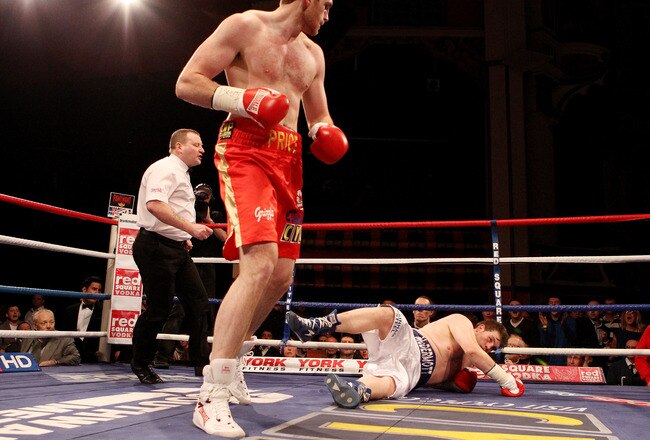 LIVERPOOL, ENGLAND - JANUARY 21:  David Price knocks down John McDermott during their British and Commonwealth Heavyweight Title Eliminator at Liverpool Olympia on January 21, 2012 in Liverpool, England.  (Photo by Scott Heavey/Getty Images)