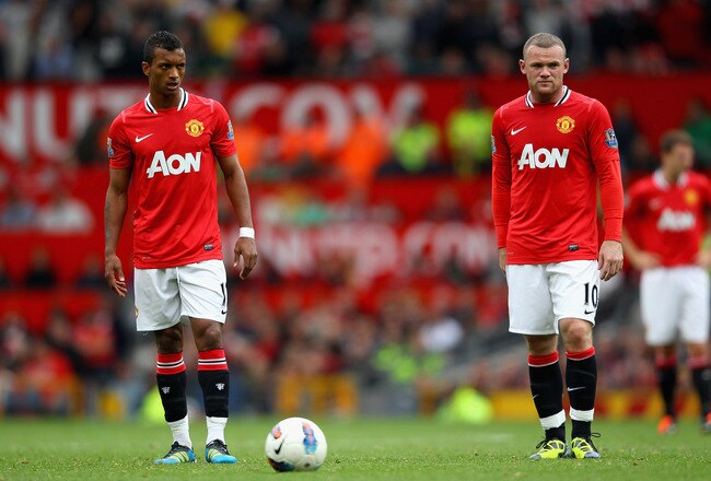 MANCHESTER, ENGLAND - AUGUST 28:  Nani and Wayne Rooney of Manchester United prepare to take a free kick during the Barclays Premier League match between Manchester United and Arsenal at Old Trafford on August 28, 2011 in Manchester, England.  (Photo by Alex Livesey/Getty Images)