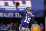 EAST RUTHERFORD, NJ - JANUARY 08:  Eli Manning #10 of the New York Giants throws a pass against the Atlanta Falcons during their NFC Wild Card Playoff game at MetLife Stadium on January 8, 2012 in East Rutherford, New Jersey.  (Photo by Nick Laham/Getty Images)