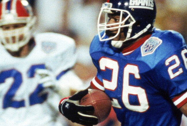 TAMPA, FL - JANUARY 27:  Kick returner Dave Duerson #26 of the New York Giants carries the ball against the Buffalo Bills during Super Bowl XXV at Tampa Stadium on January 27, 1991 in Tampa, Florida. The Giants defeated the Bills 20-19.  (Photo by George Rose/Getty Images)