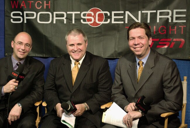 EAST RUTHERFORD, NJ - JUNE 9:  TSN reporters (L-R) Pierre McGuire, Bob McKenzie and Gord Miller during game seven of the 2003 Stanley Cup Finals between the New Jersey Devils and the Mighty Ducks of Anaheim at Continental Airlines Arena on June 9, 2003 in East Rutherford, New Jersey. The Devils defeated the Ducks 3-0 to win the Stanley Cup. (Photo by Dave Sandford/Getty Images/NHLI)