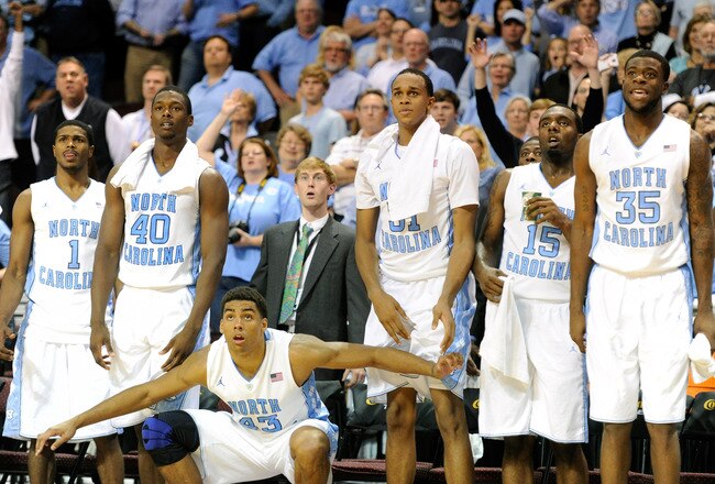 LAS VEGAS, NV - NOVEMBER 25:  (L-R) Dexter Strickland #1, Harrison Barnes #40, James Michael McAdoo #43, John Henson #31, P.J. Hairston #15 and Reggie Bullock #35 of the North Carolina Tar Heels react on the bench as they watch teammates play late in their game against the South Carolina Gamecocks during the third round of the Continental Tire Las Vegas Invitational at the Orleans Arena November 25, 2011 in Las Vegas, Nevada. North Carolina won 87-62.  (Photo by Ethan Miller/Getty Images)