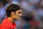 MELBOURNE, AUSTRALIA - JANUARY 22:  Roger Federer of Switzerlandlooks on in his fourth round match against  Bernard Tomic of Australia during day seven of the 2012 Australian Open at Melbourne Park on January 22, 2012 in Melbourne, Australia.  (Photo by Cameron Spencer/Getty Images)
