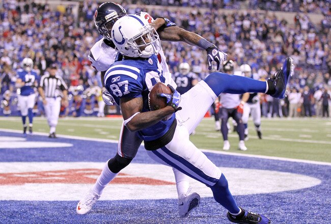 INDIANAPOLIS, IN - DECEMBER 22:  Reggie Wayne #87 of the Indianapolis Colts catches the game winning touchdown during the NFL against the Houston Texans at Lucas Oil Stadium on December 22, 2011 in Indianapolis, Indiana.  The Colts won 19-16. (Photo by Andy Lyons/Getty Images)