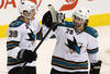 WINNIPEG, CANADA - JANUARY 12: Logan Couture #39 of the San Jose Sharks is congratulated by teammate Benn Ferriero #78 after his goal in the second period in NHL action at the MTS Centre on January 12, 2012 in Winnipeg, Manitoba, Canada. (Photo by Marianne Helm/Getty Images)