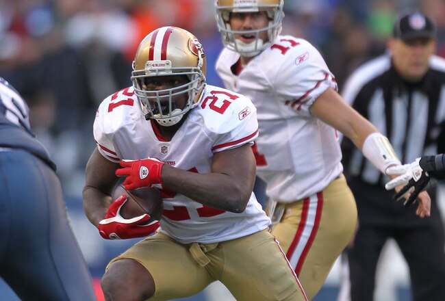 SEATTLE - DECEMBER 24:  Running back Frank Gore #21 of the San Francisco 49ers rushes against the Seattle Seahawks at CenturyLink Field on December 24, 2011 in Seattle, Washington. (Photo by Otto Greule Jr/Getty Images)