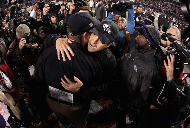BALTIMORE, MD - NOVEMBER 24:  Head coach Jim Harbaugh of the San Francisco 49ers  (L) hugs his brother head coach John Harbaugh of the Baltimore Ravens (R) after the Ravens defeated the 49ers 16-6 at M&T Bank Stadium on November 24, 2011 in Baltimore, Maryland.  (Photo by Rob Carr/Getty Images)