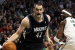 BOSTON, MA - JANUARY 03:  Kevin Love #42 of the Minnesota Timberwolves drives around Jermaine O'Neal #7 of the Boston Celtics on January 3, 2011 at the TD Garden in Boston, Massachusetts. The Celtics defeated the Timberwolves 96-93. NOTE TO USER: User expressly acknowledges and agrees that, by downloading and/or using this Photograph, User is consenting to the terms and conditions of the Getty Images License Agreement.  (Photo by Elsa/Getty Images)