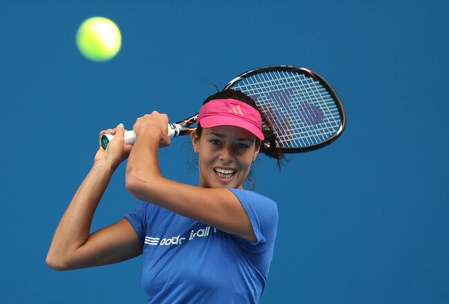 MELBOURNE, AUSTRALIA - JANUARY 12:  Ana Ivanovic of Serbia plays a backhand during practice ahead of the 2012 Australian Open at Rod Laver Arena on January 12, 2012 in Melbourne, Australia.  (Photo by Scott Barbour/Getty Images)