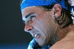 MELBOURNE, AUSTRALIA - JANUARY 22:  Rafael Nadal of Spain cools off during a break in his fourth round match against Feliciano Lopez of Spain during day seven of the 2012 Australian Open at Melbourne Park on January 22, 2012 in Melbourne, Australia.  (Photo by Scott Barbour/Getty Images)