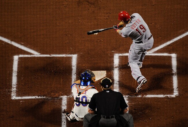 NEW YORK, NY - SEPTEMBER 27:  Joey Votto #19 of the Cincinnati Reds bats against the New York Mets in the first inning of a game at Citi Field on September 27, 2011 in the Flushing neighborhood of the Queens borough of New York City.  (Photo by Patrick McDermott/Getty Images)