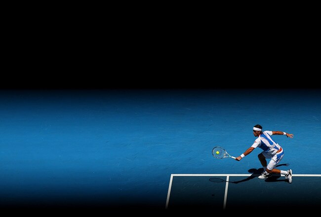 MELBOURNE, AUSTRALIA - JANUARY 22:  Feliciano Lopez of Spain plays a backhand in his fourth round match against Rafael Nadal of Spain during day seven of the 2012 Australian Open at Melbourne Park on January 22, 2012 in Melbourne, Australia.  (Photo by Cameron Spencer/Getty Images)