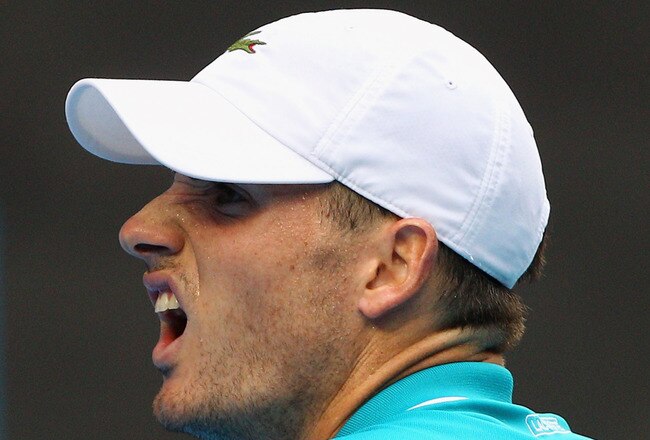 MELBOURNE, AUSTRALIA - JANUARY 20:  John Isner of the United States reacts in his third round match against Feliciano Lopez of Spain during day five of the 2012 Australian Open at Melbourne Park on January 20, 2012 in Melbourne, Australia.  (Photo by Lucas Dawson/Getty Images)