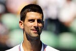 MELBOURNE, AUSTRALIA - JANUARY 19:  Novak Djokovic of Serbia looks on in his second round match against Santiago Giraldo of Colombia during day four of the 2012 Australian Open at Melbourne Park on January 19, 2012 in Melbourne, Australia.  (Photo by Scott Barbour/Getty Images)