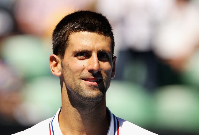 MELBOURNE, AUSTRALIA - JANUARY 19:  Novak Djokovic of Serbia looks on in his second round match against Santiago Giraldo of Colombia during day four of the 2012 Australian Open at Melbourne Park on January 19, 2012 in Melbourne, Australia.  (Photo by Scott Barbour/Getty Images)