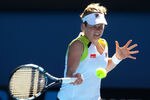 MELBOURNE, AUSTRALIA - JANUARY 22:  Kim Clijsters of Belgium plays a forehand in her fourth round match against Na Li of China during day seven of the 2012 Australian Open at Melbourne Park on January 22, 2012 in Melbourne, Australia.  (Photo by Cameron Spencer/Getty Images)
