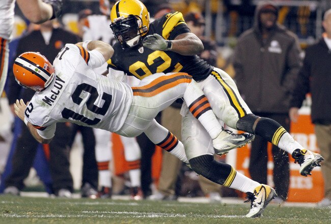 PITTSBURGH, PA - DECEMBER 8:   James Harrison #92 of the Pittsburgh Steelers tackles  Colt McCoy #12 of the Cleveland Browns during the game on December 8, 2011 at Heinz Field in Pittsburgh, Pennsylvania.  The Steelers won 14-3.  (Photo by Justin K. Aller/Getty Images)