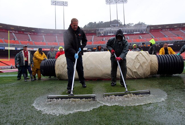 SAN FRANCISCO, CA - JANUARY 22:  Members of the grounds crew squeegee water off of the field prior to the San Francisco 49ers host the New York Giants the field during the NFC Championship Game at Candlestick Park on January 22, 2012 in San Francisco, California.  (Photo by Doug Pensinger/Getty Images)