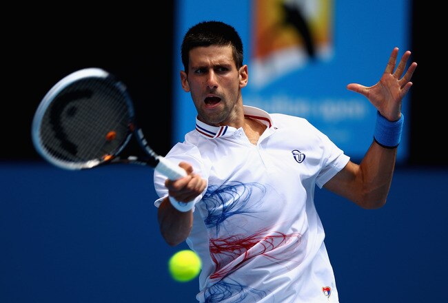 MELBOURNE, AUSTRALIA - JANUARY 21:  Novak Djokovic of Serbia plays a forehand in his third round match against Nicholas Mahut of France during day six of the 2012 Australian Open at Melbourne Park on January 21, 2012 in Melbourne, Australia.  (Photo by Clive Brunskill/Getty Images)