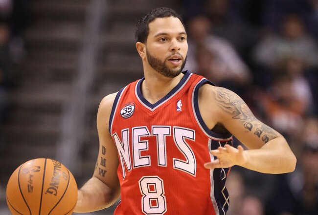 PHOENIX, AZ - JANUARY 13:  Deron Williams #8 of the New Jersey Nets in action during the NBA game against the Phoenix Suns at US Airways Center on January 13, 2012 in Phoenix, Arizona. The Nets defeated the Suns 110-103.   NOTE TO USER: User expressly acknowledges and agrees that, by downloading and or using this photograph, User is consenting to the terms and conditions of the Getty Images License Agreement.  (Photo by Christian Petersen/Getty Images)