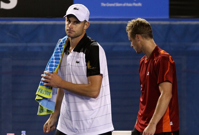 MELBOURNE, AUSTRALIA - JANUARY 19:  Andy Roddick (L) of the USA walks from the court after retiring in his second round match against Lleyton Hewitt of Australia during day four of the 2012 Australian Open at Melbourne Park on January 19, 2012 in Melbourne, Australia.  (Photo by Quinn Rooney/Getty Images)