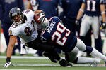 FOXBORO, MA - JANUARY 22:   Sterling Moore #29 of the New England Patriots tackles Lee Evans #83 of the Baltimore Ravens during their AFC Championship Game at Gillette Stadium on January 22, 2012 in Foxboro, Massachusetts.  (Photo by Rob Carr/Getty Images)