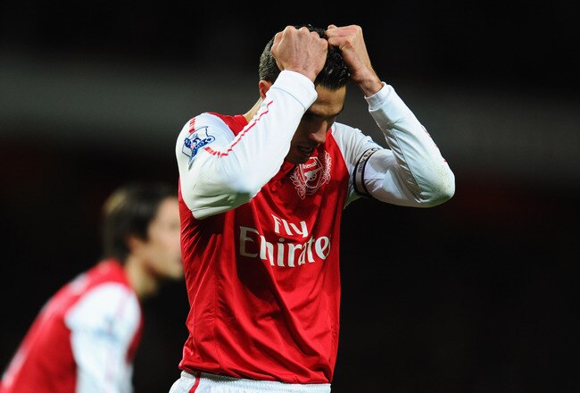 LONDON, ENGLAND - JANUARY 22:  Robin van Persie of Arsenal reacts after a missed chance during the Barclays Premier League match between Arsenal and Manchester United at Emirates Stadium on January 22, 2012 in London, England.  (Photo by Mike Hewitt/Getty Images)