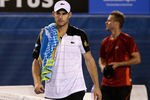 MELBOURNE, AUSTRALIA - JANUARY 19:  Andy Roddick (L) of the USA walks from the court after retiring in his second round match against Lleyton Hewitt of Australia during day four of the 2012 Australian Open at Melbourne Park on January 19, 2012 in Melbourne, Australia.  (Photo by Quinn Rooney/Getty Images)