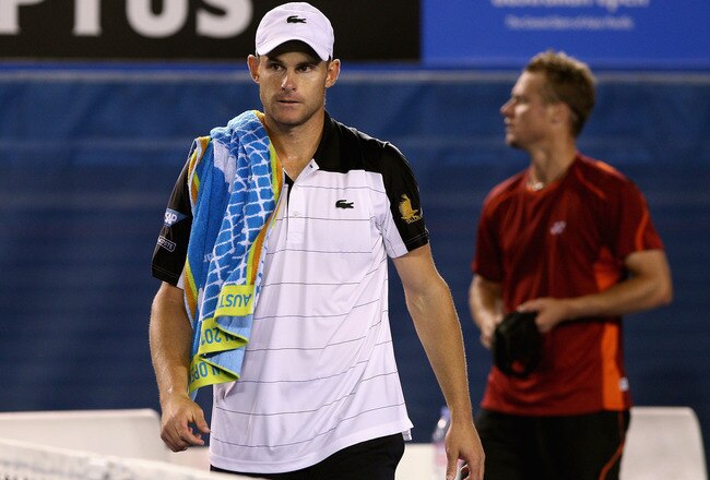 MELBOURNE, AUSTRALIA - JANUARY 19:  Andy Roddick (L) of the USA walks from the court after retiring in his second round match against Lleyton Hewitt of Australia during day four of the 2012 Australian Open at Melbourne Park on January 19, 2012 in Melbourne, Australia.  (Photo by Quinn Rooney/Getty Images)