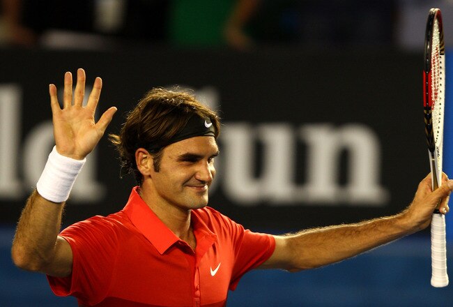 MELBOURNE, AUSTRALIA - JANUARY 22:  Roger Federer of Switzerland thanks the crowd after winning his fourth round match against  Bernard Tomic of Australia during day seven of the 2012 Australian Open at Melbourne Park on January 22, 2012 in Melbourne, Australia.  (Photo by Mark Dadswell/Getty Images)