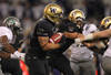 SEATTLE - NOVEMBER 05:  Running back Chris Polk #1 of the Washington Huskies rushes against the Oregon Ducks on November 5, 2011 at Husky Stadium in Seattle, Washington. Oregon won 34-17. (Photo by Otto Greule Jr/Getty Images)