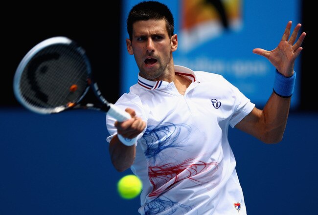 MELBOURNE, AUSTRALIA - JANUARY 21:  Novak Djokovic of Serbia plays a forehand in his third round match against Nicholas Mahut of France during day six of the 2012 Australian Open at Melbourne Park on January 21, 2012 in Melbourne, Australia.  (Photo by Clive Brunskill/Getty Images)